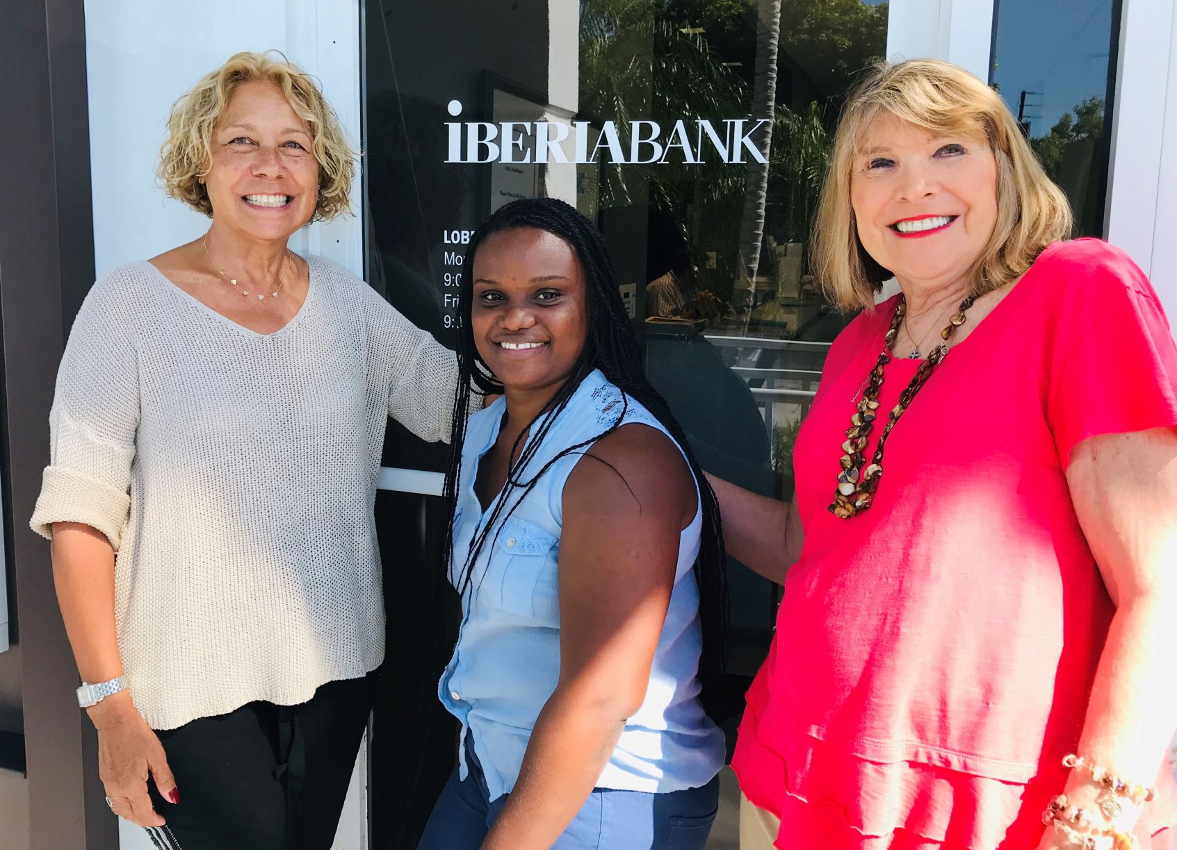 Michele Estevez, Elsie Bain-Auguste and Dr.Elsa Dominguez at Iberia Bank where the Auguste family opened an account